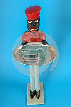 Statue of a black servant with a tacker on the tray