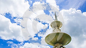 Statue with a bright sky