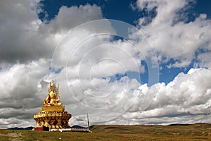 A statue of Buddha around the Yarchen Gar Yaqen Orgyan Temple