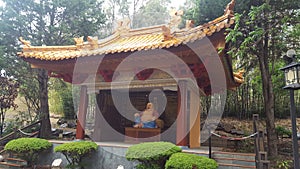 Statue of Buddha in the gardens of the Nan Tien Temple, situated at Unanderra, near Wollongong, NSW, Australia