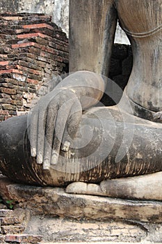 statue of buddha in a ruined buddhist temple (wat mahathat) in sukhothai (thailand)