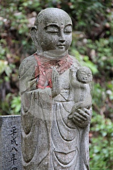 statue of a buddhist divinity at the reiko-ji temple at the tachikue gorge (japan)