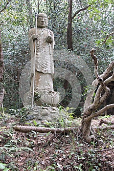 statue of a buddhist divinity at the tachikue gorge (japan)