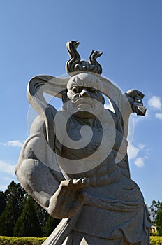 Statue in the buddhist temple of Iguassu Falls, Brazil. photo