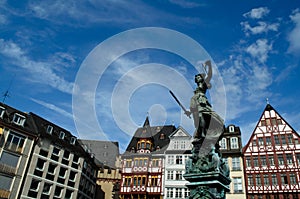 Statue and building at Romer Platz in Frankfurt photo