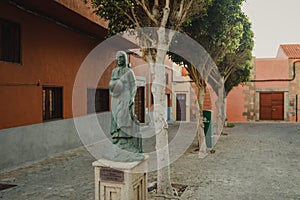 A statue of a Canarian woman holding a water jar in Aguimes, Gran Canaria