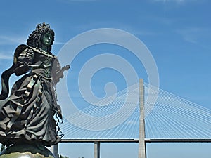 Statue of Catherine of Braganza with Vasco da Gama bridge , Lisbon - Portugal