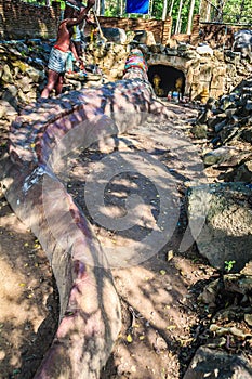 Statue of Chalawan and Kraithong at the front of the Chalawan cave (Chalawan is the king of crocodile in Thai literary), a deep ho