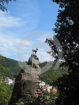 Statue of chamois over the Karlovy Vary spa town.