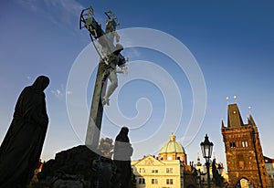 Statue at the Charles Bridge in Prague photo