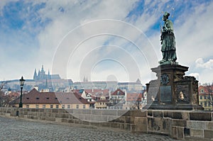 Statue in Charles Bridge,Prague Castle view