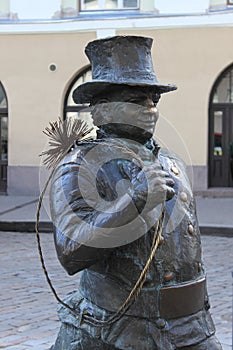 Statue of a chimney sweeps in Tallinn