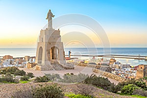 Statue of Christ staying above the Almeria city photo