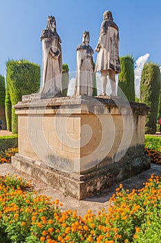 Statue of Christian kings Ferdinand and Isabella and Christopher Columbus in Alcazar de los Reyes Cristianos in Cordoba, Spa