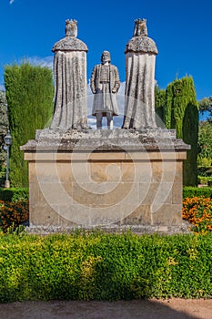 Statue of Christian kings Ferdinand and Isabella and Christopher Columbus in Alcazar de los Reyes Cristianos in Cordoba, Spa