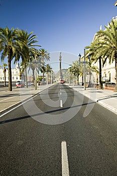Statue of Christopher Columbus overlooks roadway on Passeig de Colom, next to waterfront of Port Vell, Barcelona, Spain