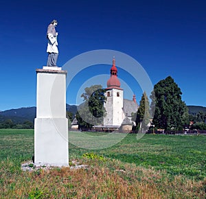 Statue and church in Liptovske Matiasovce