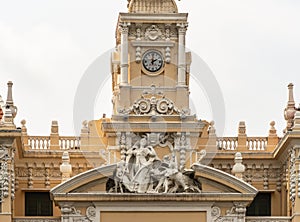 Statue on clock tower of Town hall of Ho Chi Minh City, Vietnam