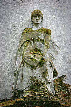 Statue covered with moss