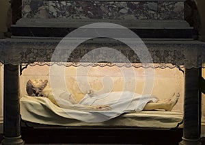 Statue of the crucified Jesus lying entombed inside the Pitigliano Cathedral in Pitigliano, Italy.