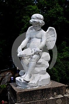 The statue of Cupid in the SOFIYIVSKY PARK IN UMAN. Ukraine.