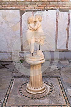 Statue of Cupido and Psyche kissing in Ostia Antica photo
