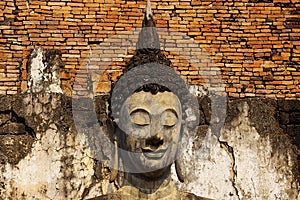 Statue of a deity in historical park Sukhothai.