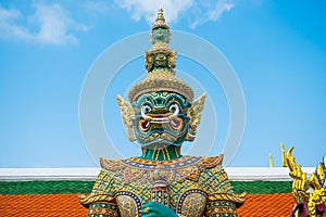 Statue of demon guardian near gates in Grand Palace, Bangkok, Thailand