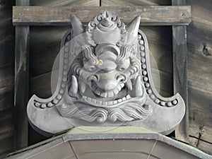 A statue depicting a Japanese devil tile at Ryoanji Temple