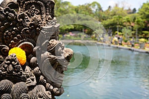 A statue detail in Tirta Gangga water palace. Karangasem Regency. Bali. Indonesia photo