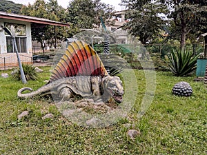 Statue of dimetrodon dinasour in a park in india