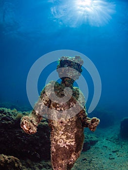 Statue of Dionysus with a crown of ivy in Claudioâ€™s Ninfeum. underwater, archeology.