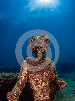 Statue of Dionysus with a crown of ivy in Claudioâ€™s Ninfeum. underwater, archeology.