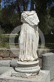 Statue displayed outdoors in the roman ruins at Byrsa photo