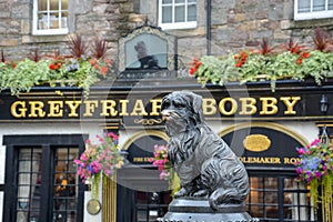 Statue of the dog Greyfriars Bobby in front of the pub in Edinburgh