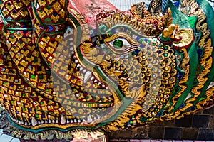 Statue of a dragon decorated with colorful glass mosaic, Wat Prathat Doi Suthep, Chiang Mai province, Thailand