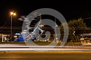 Runner statue in Athens at night