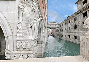 statue of Ducal Palace and the Famous bridge of Sighs in Venice