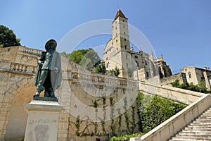 The statue of Dâ€™Artagnan in front of the monumental staircase leading to the Tower of Armagnac in Auch