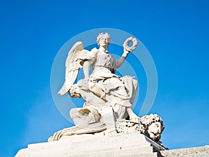 Statue at facade of Versailles Chateau entrance