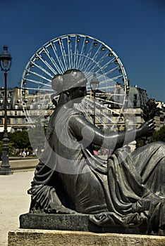 Statue and ferris wheel