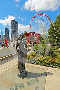 Statue, ferris wheel and cityscape at Navy Pier in Chicago, Illinois