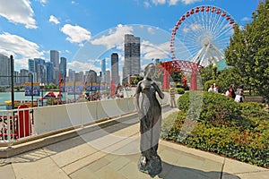 Statue, ferris wheel and cityscape at Navy Pier in Chicago, Illinois