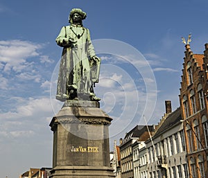 Statue of Flemish painter Jan Van Eyck on a street in Bruges