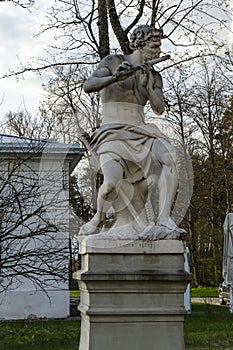 Statue of a flutist in the park of UÅ¾utrakis manor