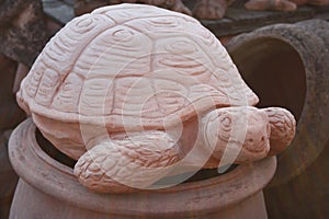 Statue in the form of a large earth tortoise or large tortoise. artistic work of a ceramic sculptor and worker. representation of