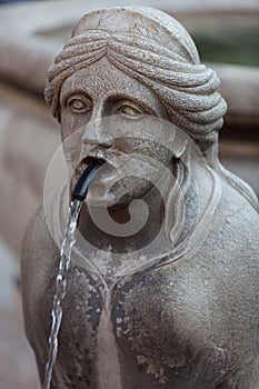 Statue-fountain on the Piazza Vecchia, upper town of Bergamo, Italy