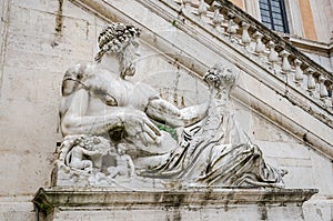 Statue on the fountain in the square del Campidoglio of Rome, capital of Italy