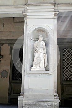 Statue of Francesco Petrarca in the niches of the Uffizi Gallery colonnade, photo
