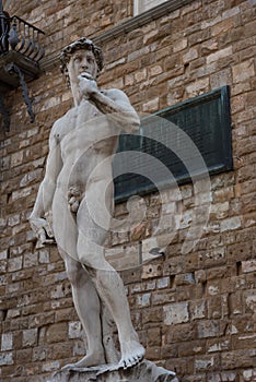 Statue in front of the Facade of Old Palace called Palazzo Vecchio at the Piazza della Signoria in Florence, Tuscany, Italy